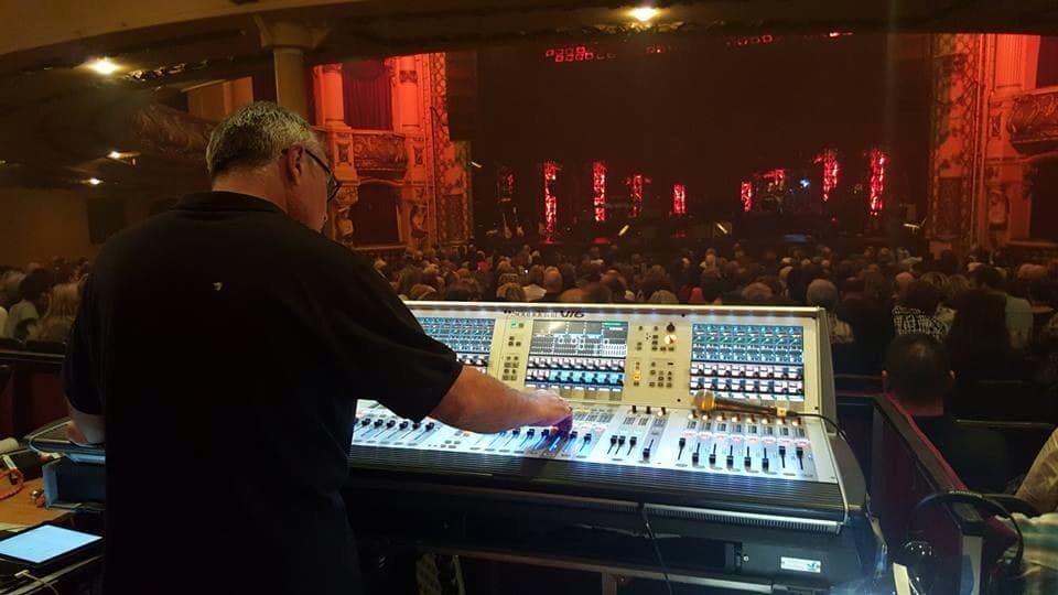 Rikki mixing a theatre show on a Soundcraft Vi6